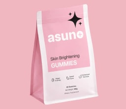A pink and white resealable bag of Asuno Skin Brightening Gummies, a vegan friendly dietary supplement for skin health